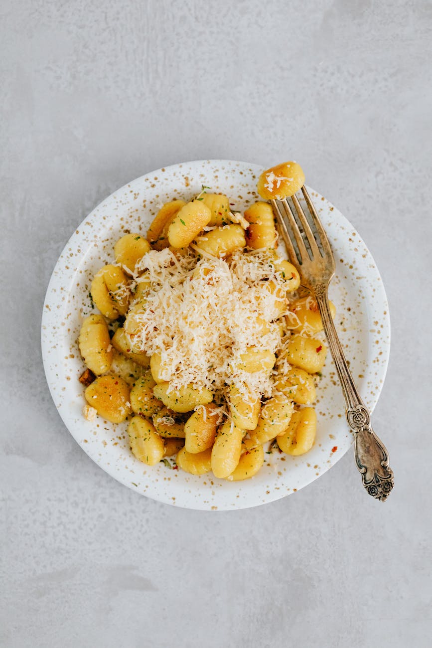 a gnocchi with cheese on top